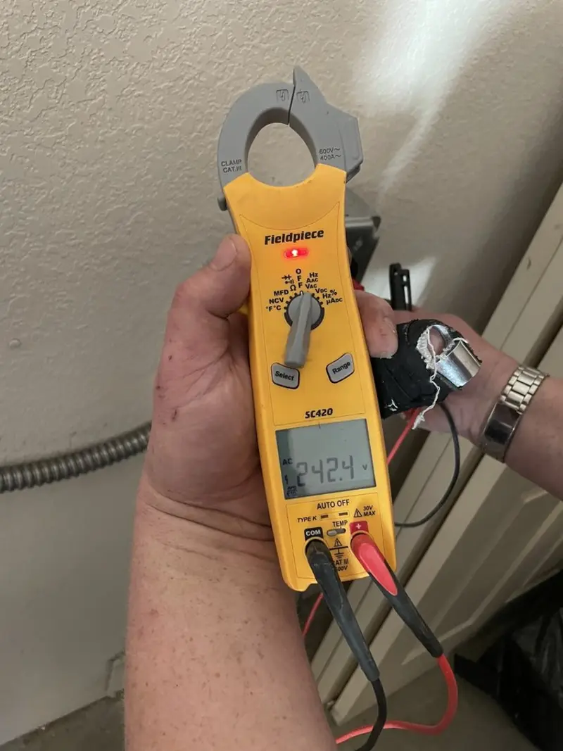 Voltage testing with clamp meter during Whole House Surge Protector in Amityville